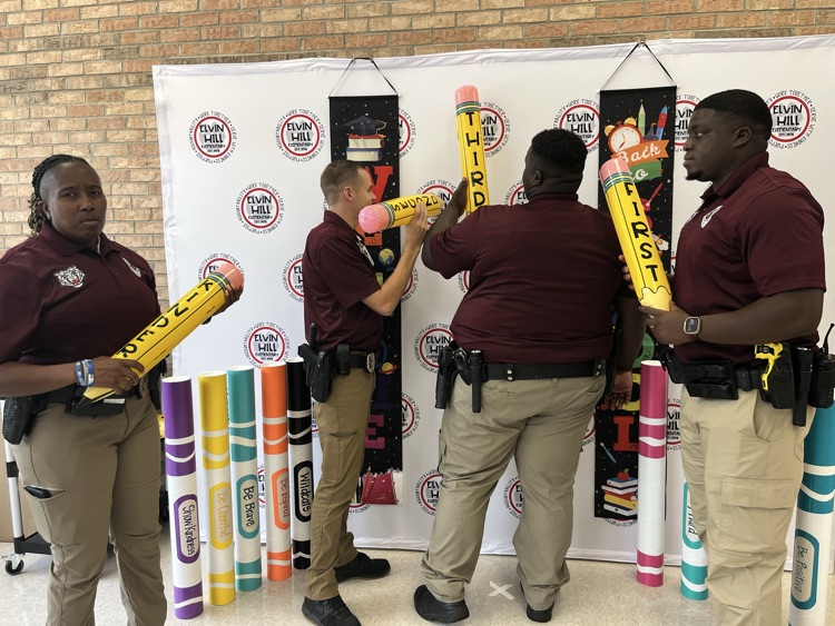 School resource officers pictured with inflatable pencils