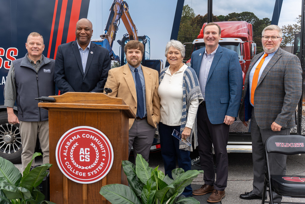 Leaders pose at ceremony.