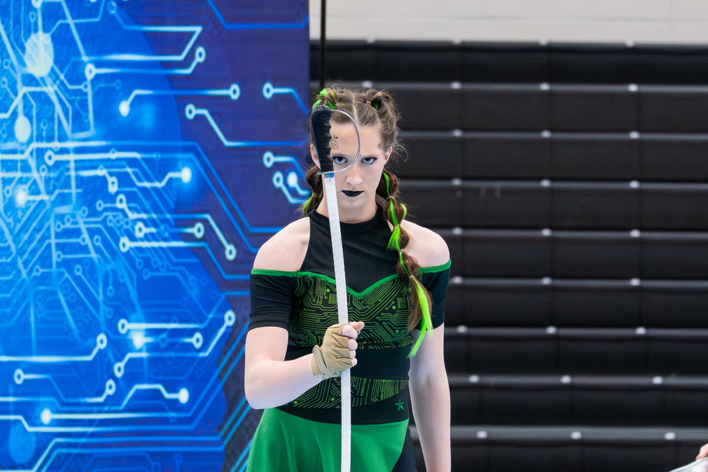 student holding saber during winter guard performance