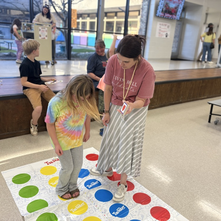 teacher and student play twister while segmenting words