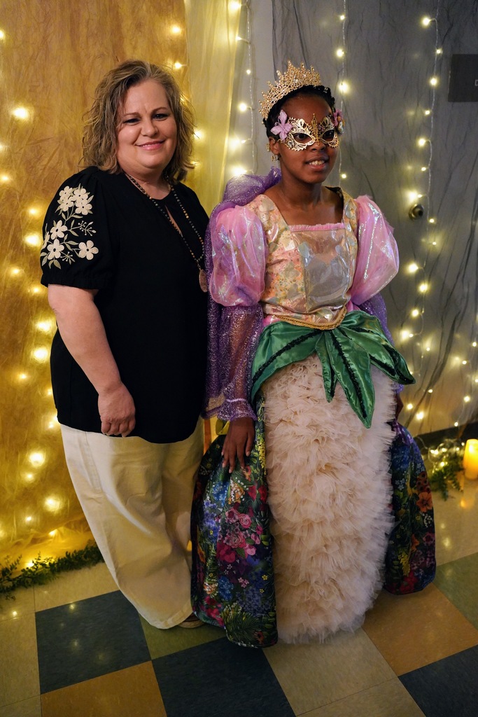 LNLC Student Holayn Marandu poses in her prom dress with seamstress Shondra Patterson 