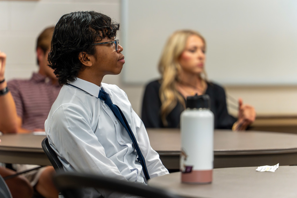 Students listen to presentations.