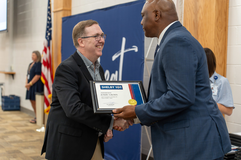 John Bohn receiving his certificate from Dr. Lewis Brooks 