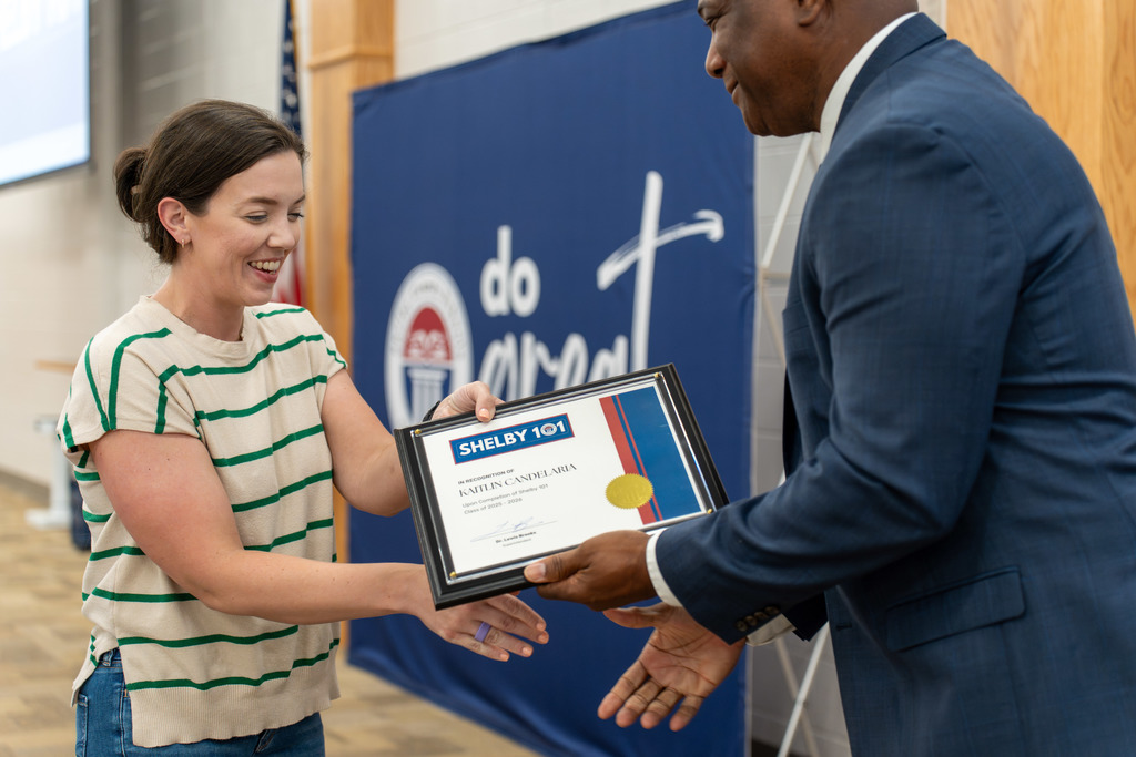 Kaitlyn Candelera receiving her certificate from Dr. Lewis Brooks 