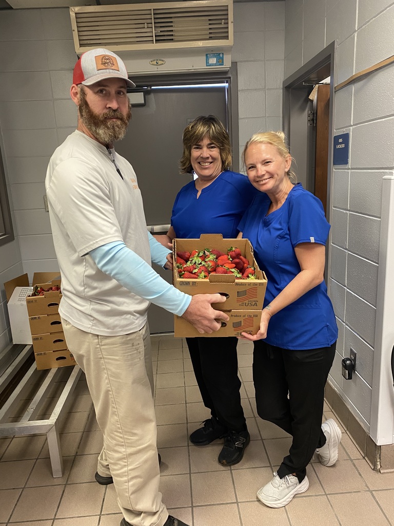 CNP workers with fresh strawberries and produce supplier