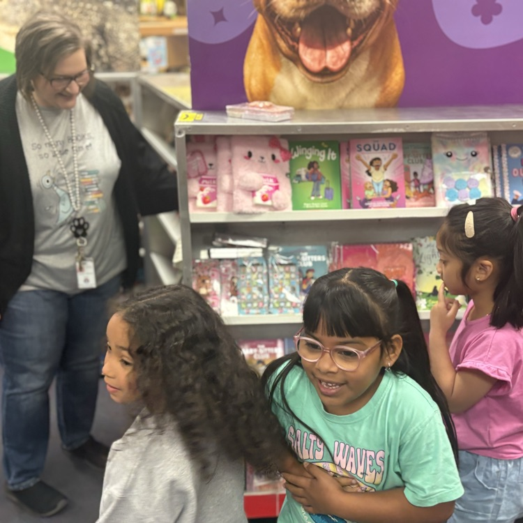 girls shopping at book fair 
