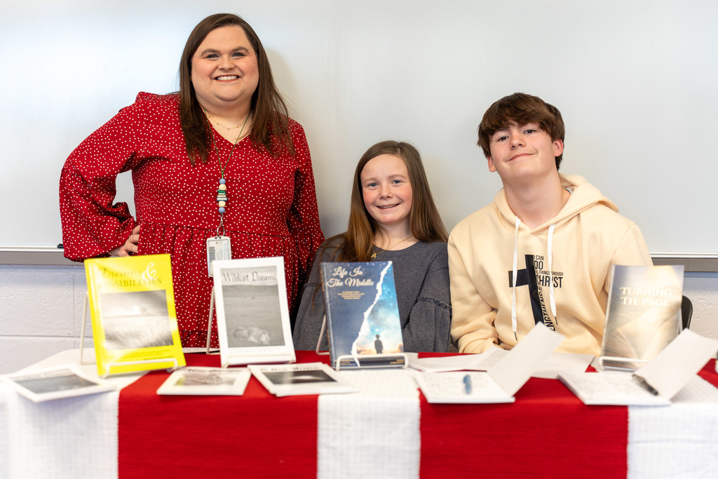 Teacher with students at Showcase of Schools event 