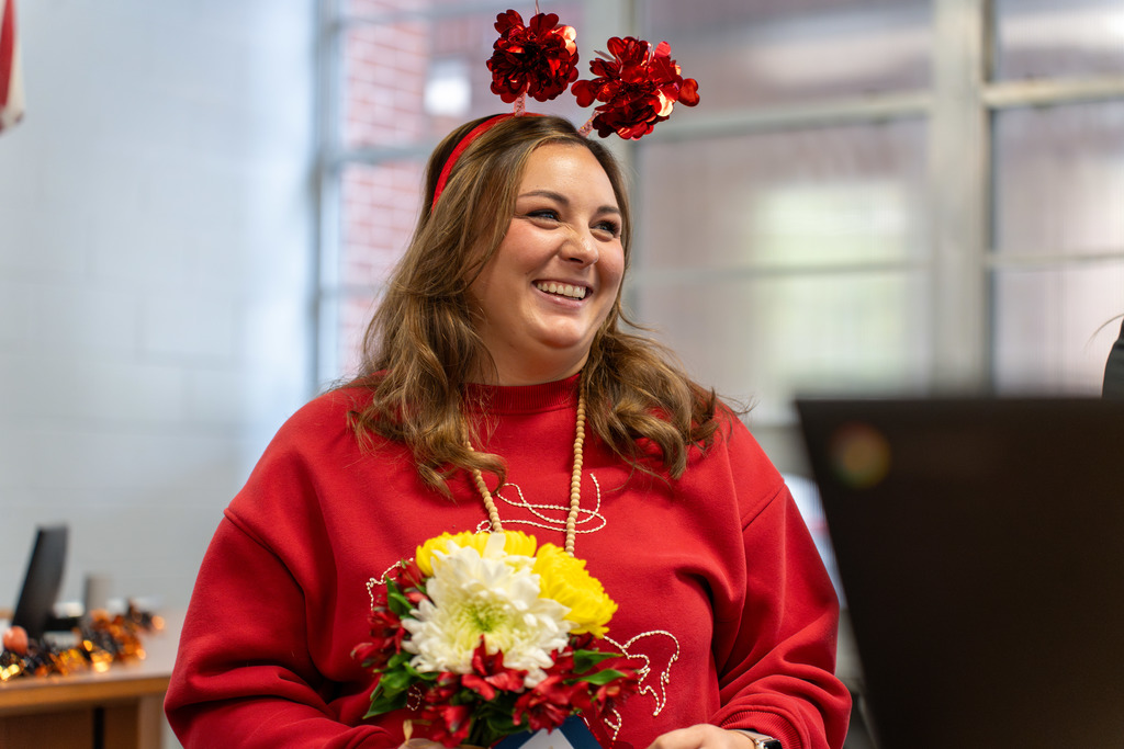 Teacher holding flowers 