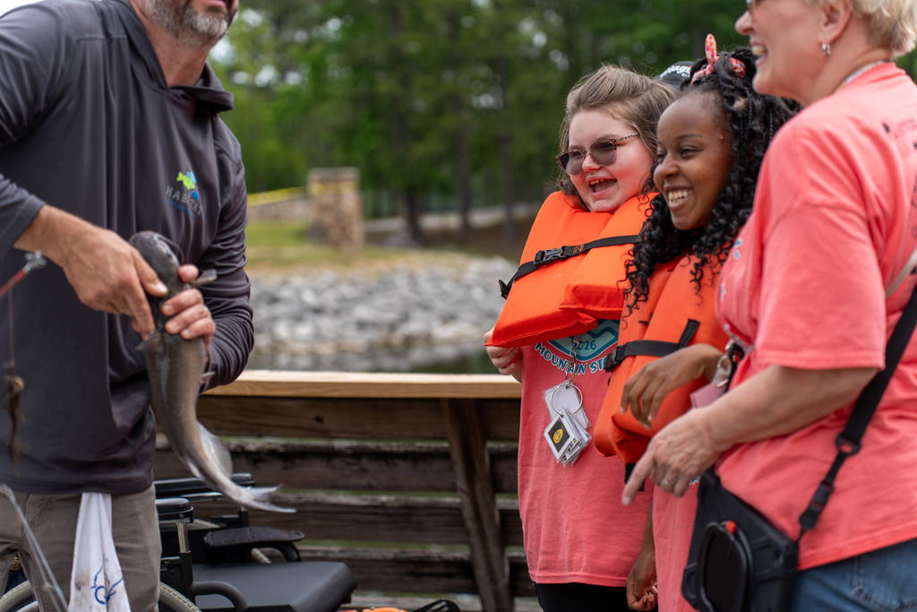 Students watch a fish at Gone Fishing event.