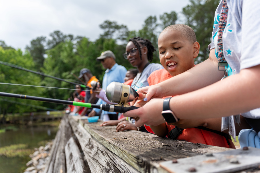 Student fishes at Gone Fishing event.