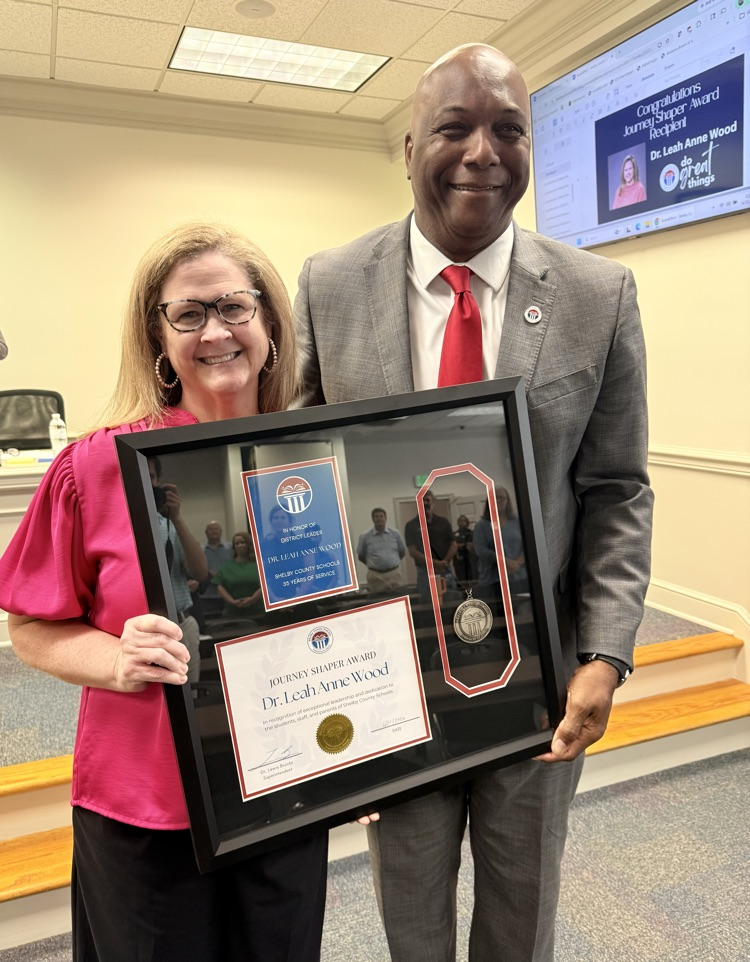 Leah Anne Wood accepts Journey Shaper Award from Dr. Lewis Brooks 