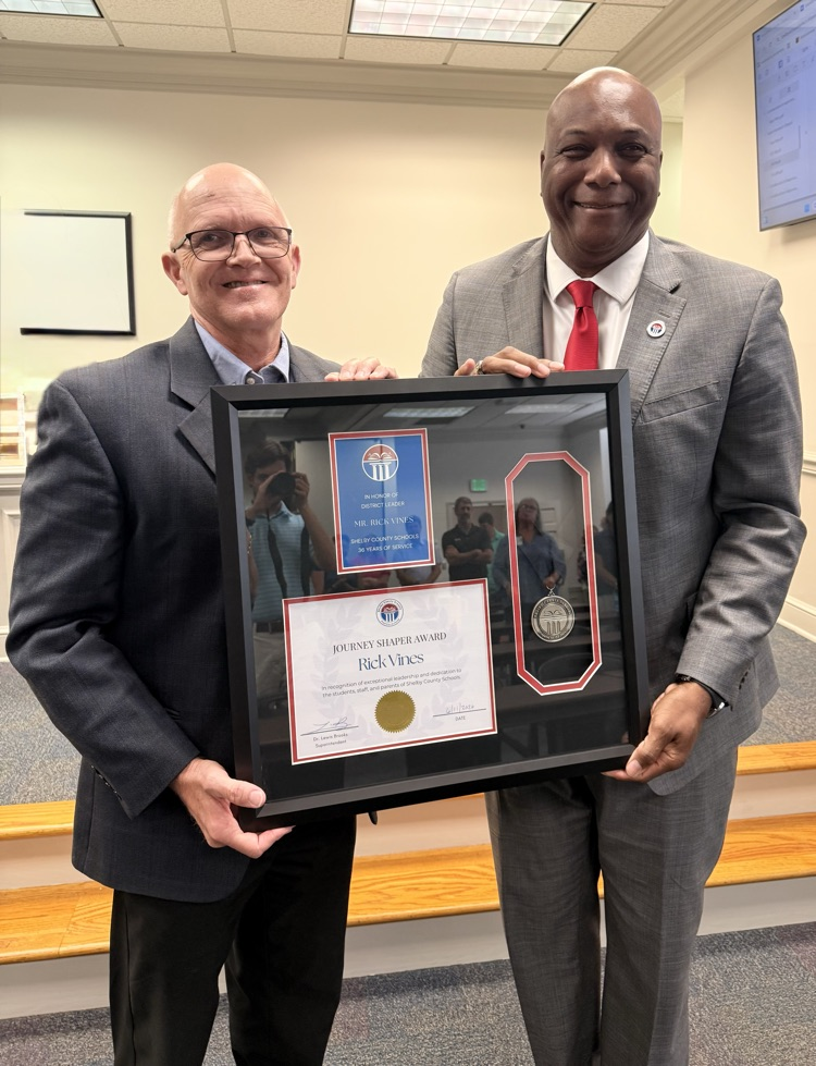 Rick Vines accepts Journey Shaper award from Dr. Lewis Brooks