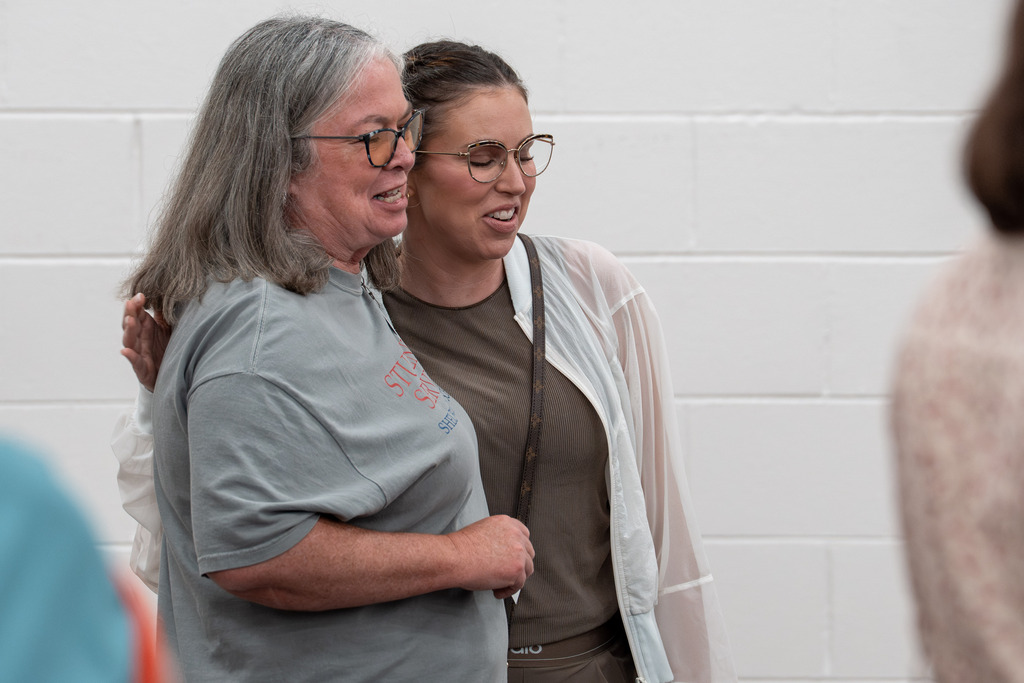 Community partner getting a hug from a SCS staff member. 