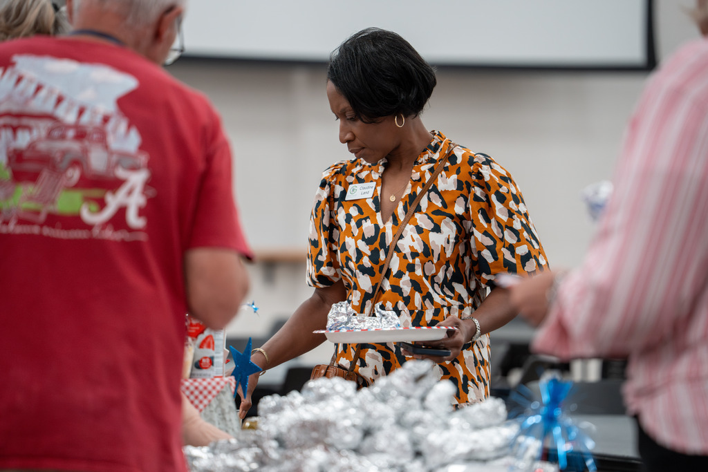 Community partner going through the food line. 