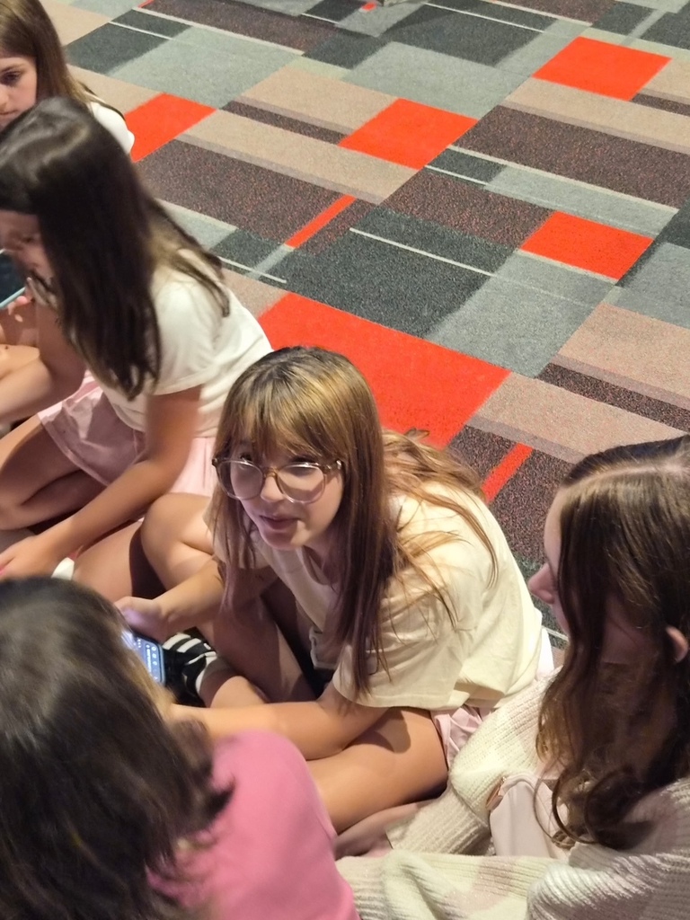 Photo of the OMMS yearbook staff in a high school auditorium