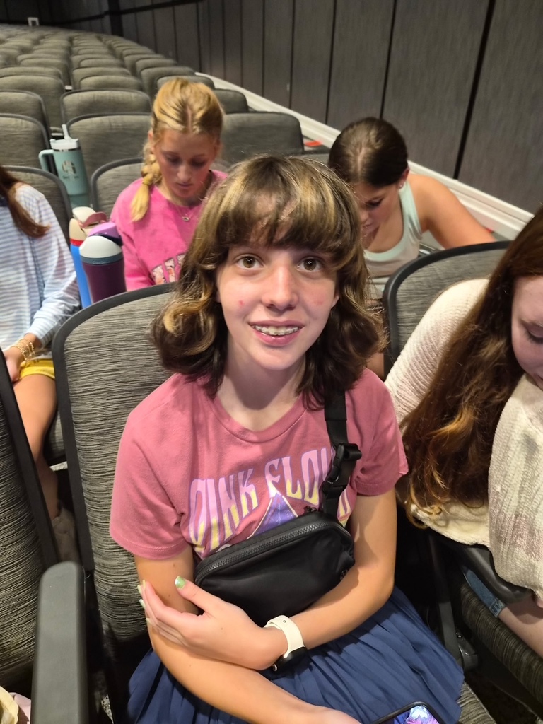 Photo of the OMMS yearbook staff in a high school auditorium