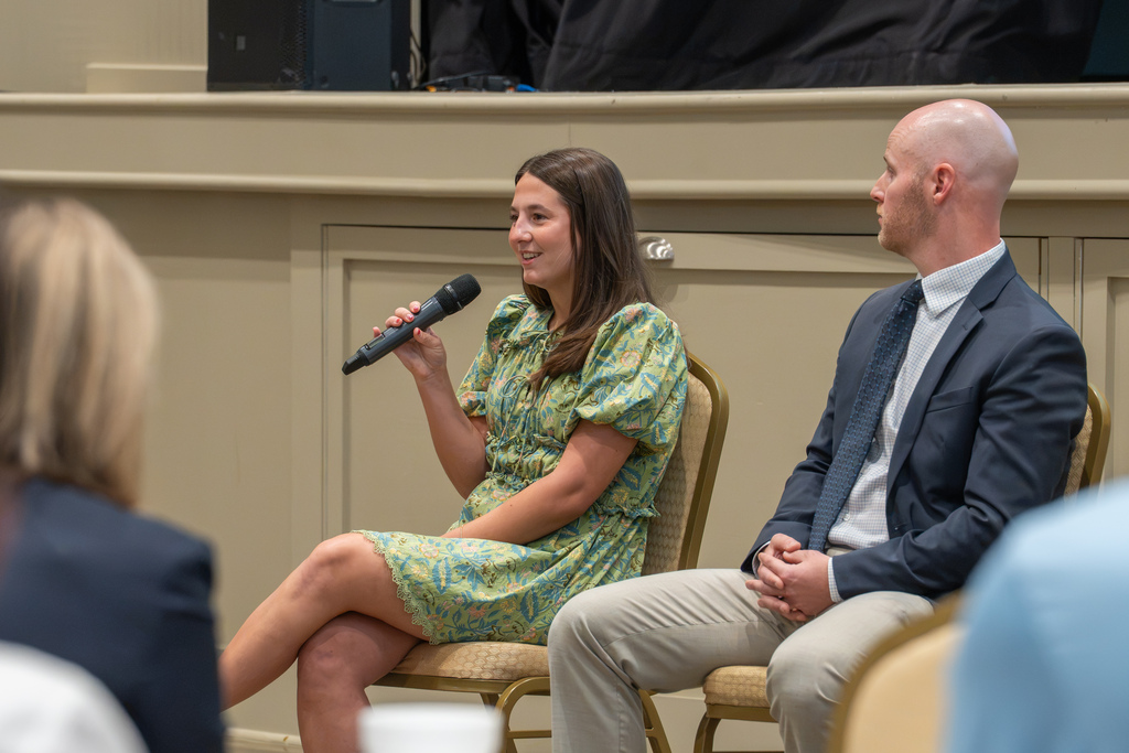 A teacher speaks during a panel discussion at State of Our Schools.