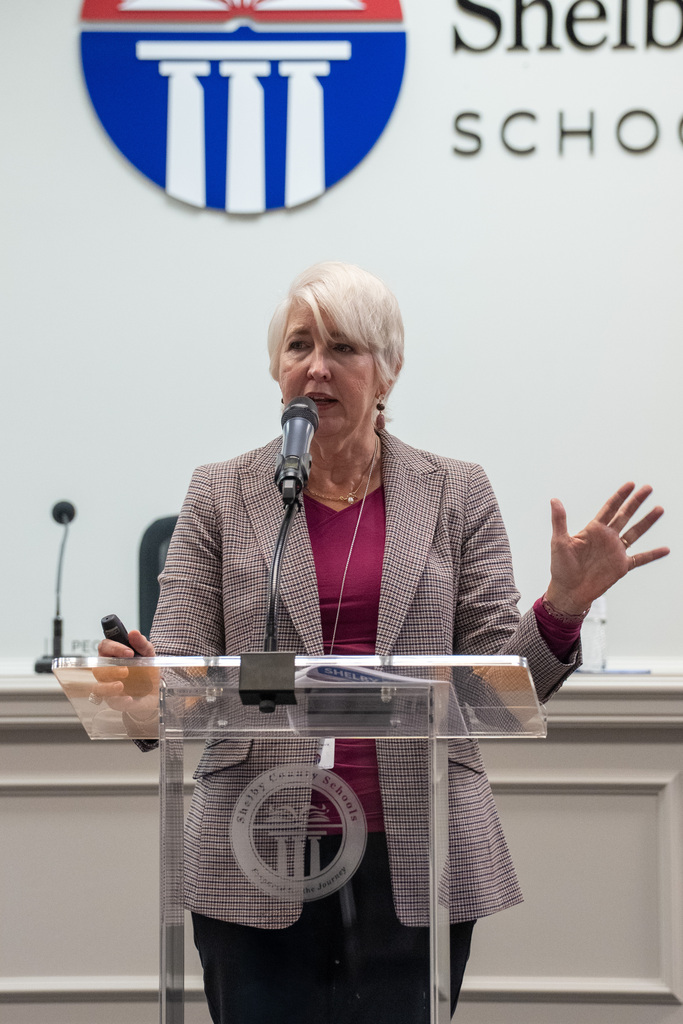 A lady speaking at Shelby 101