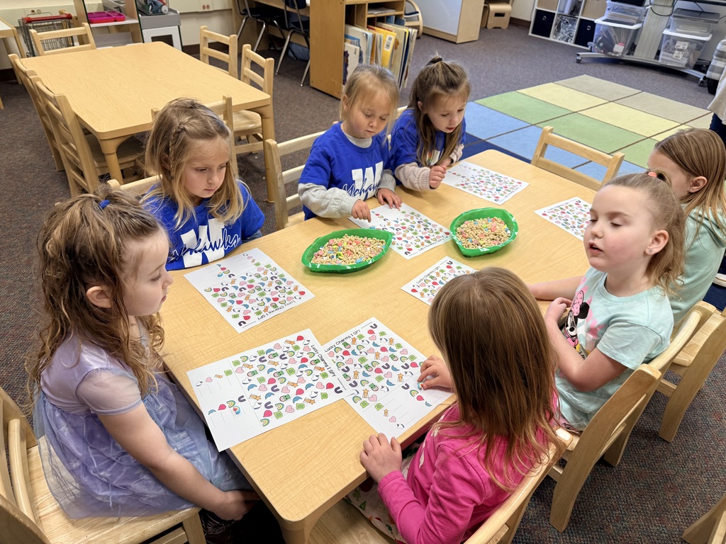 Early learners playing "I SPY" with Lucky Charms.