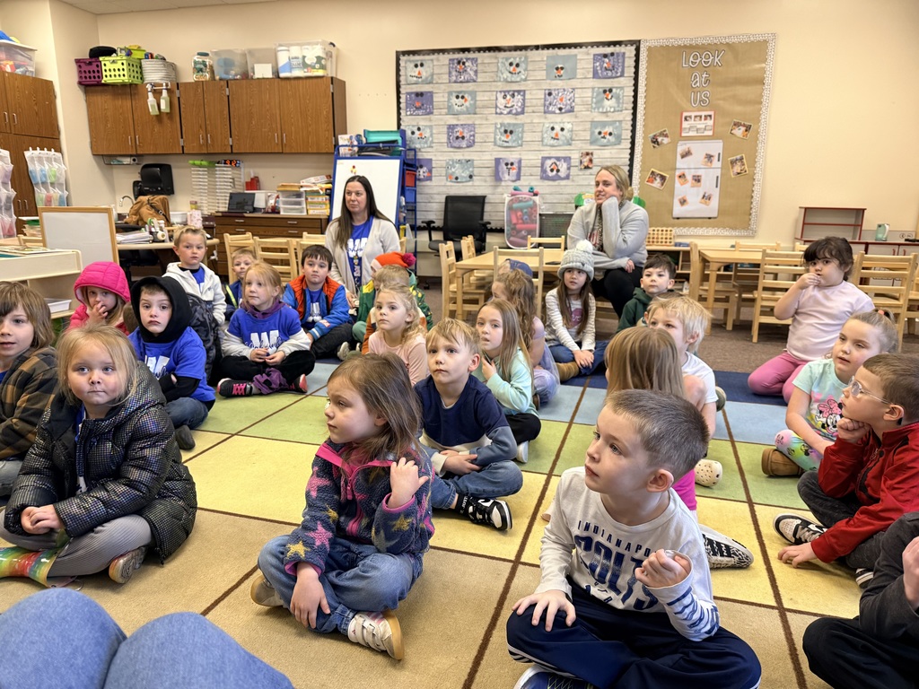 Listening to directions from the teacher.