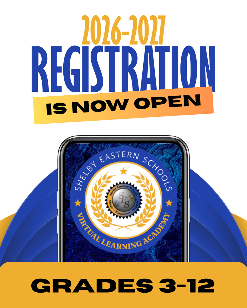 An informational flyer announcing school registration against a white background. At the top, the text "2026-2027" appears in tall, condensed yellow-gold lettering. Directly below it, the word "REGISTRATION" is written in large, bold, blue capital letters. Underneath that, an orange-to-yellow gradient banner slants slightly upward to the right, containing the black text "IS NOW OPEN". In the center of the flyer, a smartphone is displayed vertically. The screen features a dark blue, textured background with a circular logo in the middle. The logo has a blue outer ring that reads "SHELBY EASTERN SCHOOLS" along the top and "VIRTUAL LEARNING ACADEMY" along the bottom in gold text, separated by gold stars on each side. Inside the ring is a gold laurel wreath surrounding a smaller inner emblem with a globe and the initials "SES". Behind the phone, large curved blue shapes flare out to the sides. At the bottom of the image, a wide, solid yellow-gold banner stretches across the width, featuring the black text "GRADES 3-12".