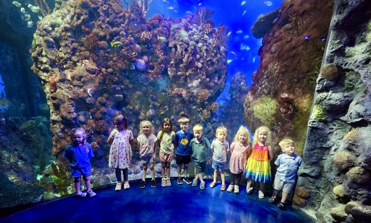 Posing in front of the aquarium