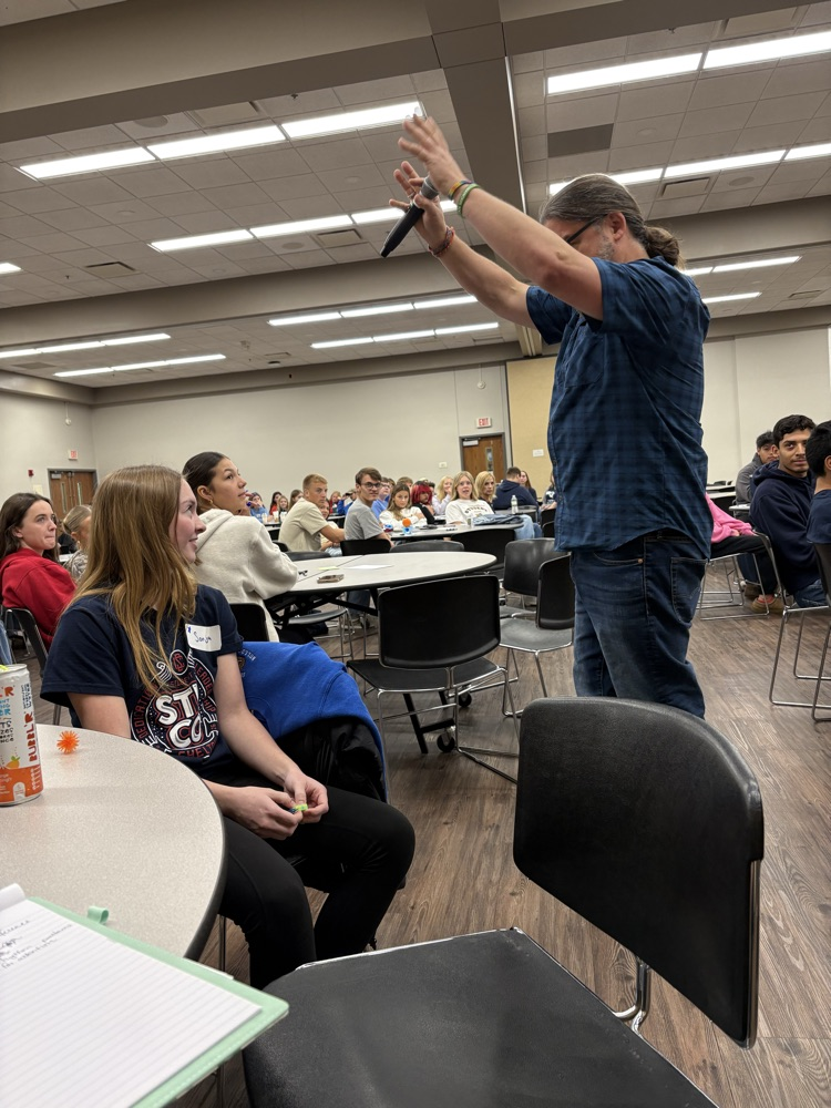 listening to the speaker