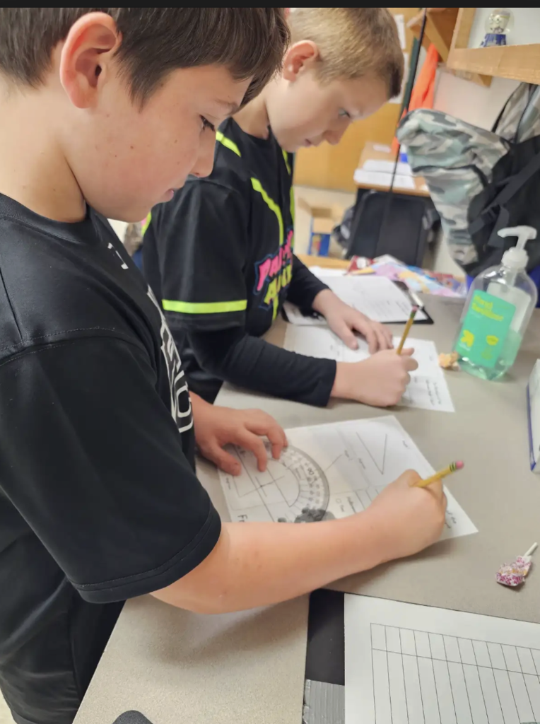 These 4th graders are angle experts! Measuring each angle carefully with their protractors.