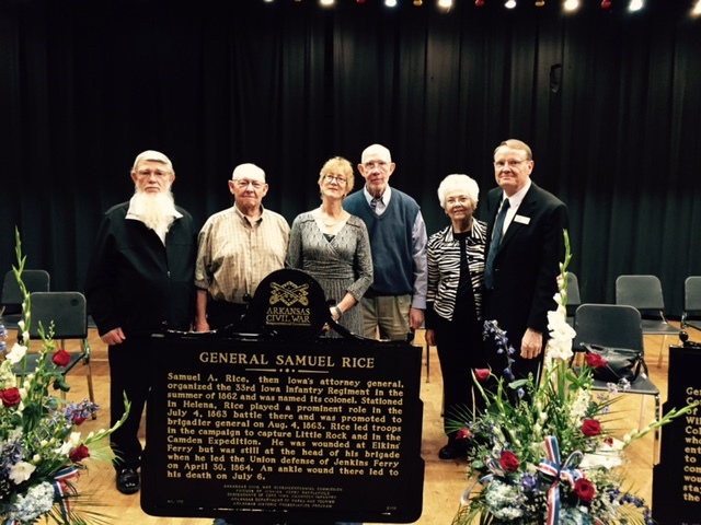General Descendants pose behind a historical market at ceremony