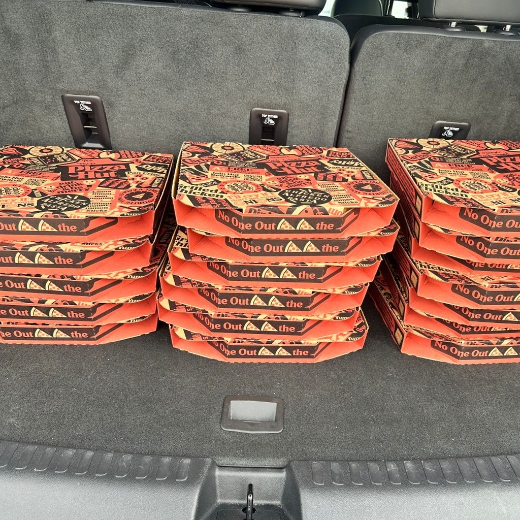 3 stacks of pizzas from Tuscola Pizza Hut