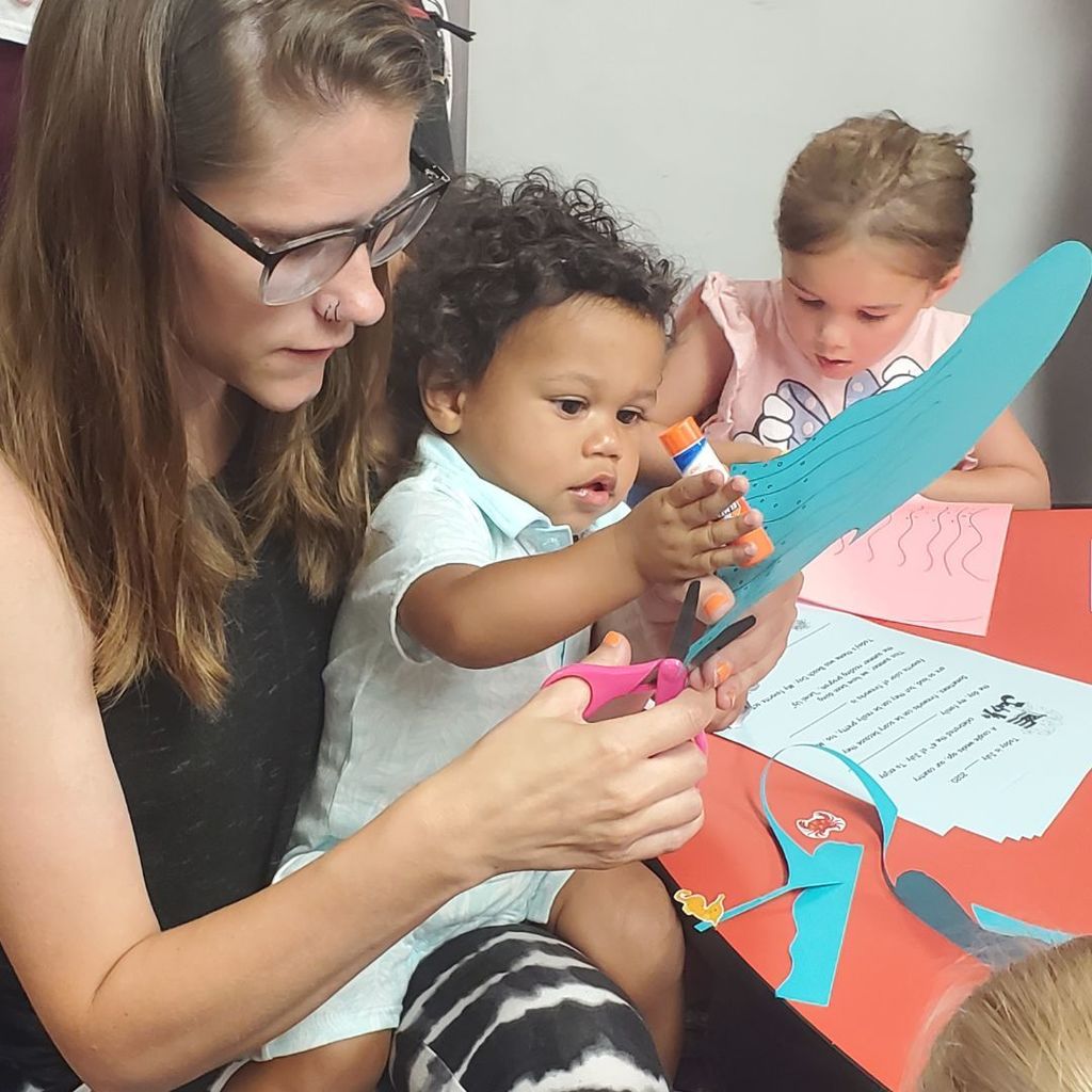 Images of children and families at PIP group connection on July 16, 2025 with beach theme activities