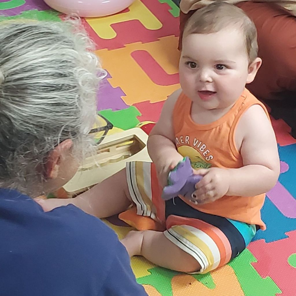 Images of children and families at PIP group connection on July 16, 2025 with beach theme activities