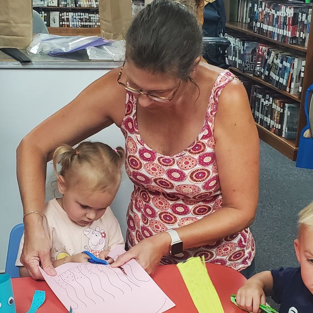 Images of children and families at PIP group connection on July 16, 2025 with beach theme activities