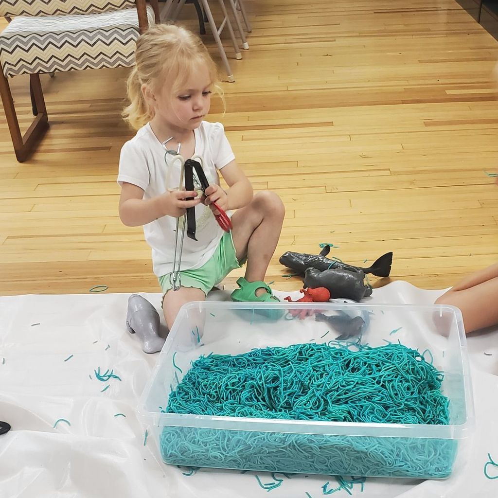 Images of children and families at PIP group connection on July 16, 2025 with beach theme activities
