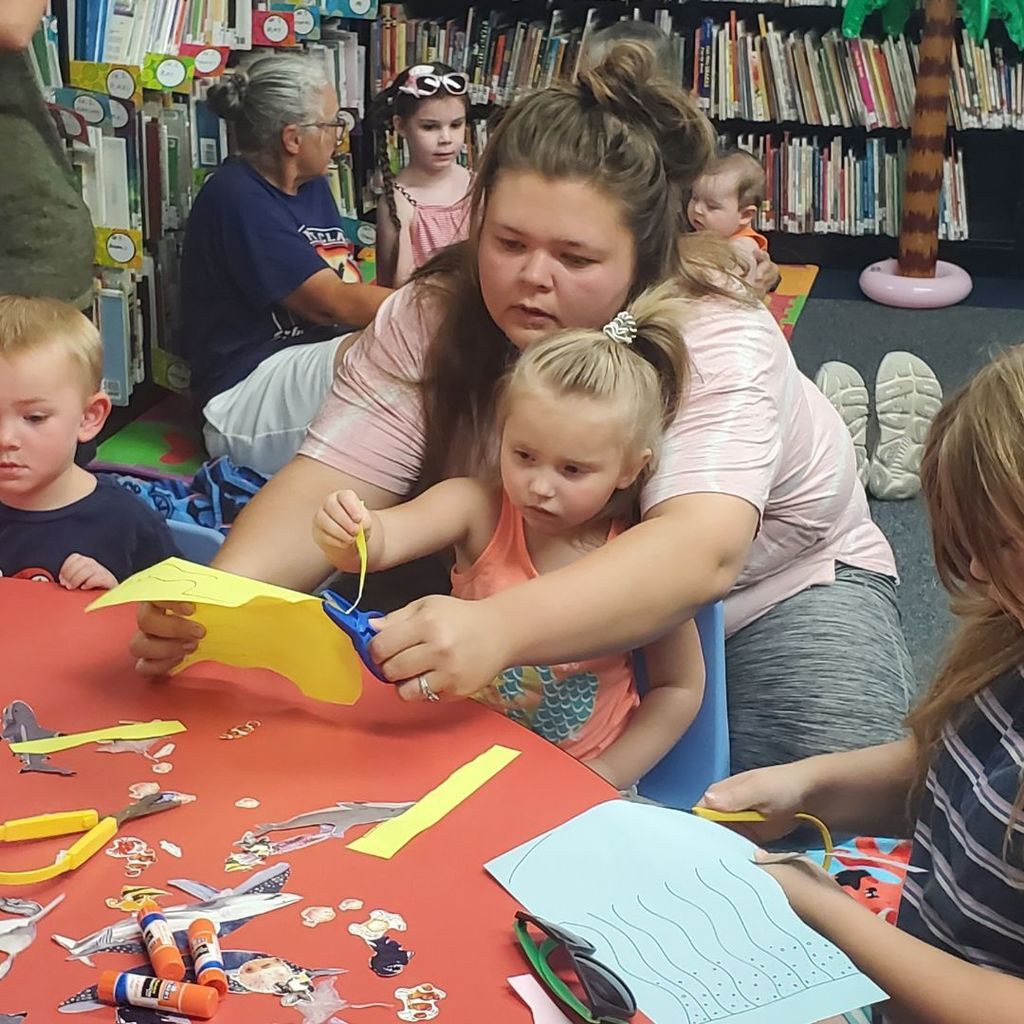 Images of children and families at PIP group connection on July 16, 2025 with beach theme activities