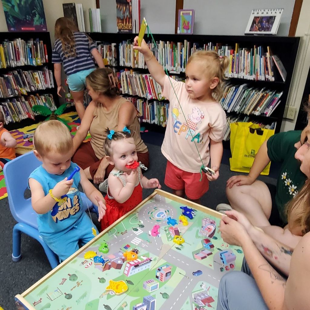Images of children and families at PIP group connection on July 16, 2025 with beach theme activities