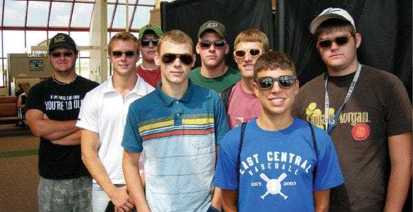 Mark Smith's students showcasing the wooden sunglasses produced in clas at Shiloh High School