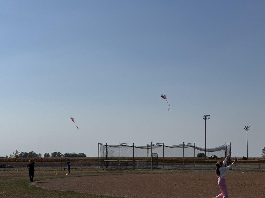 Elementary students fllying kites in PE