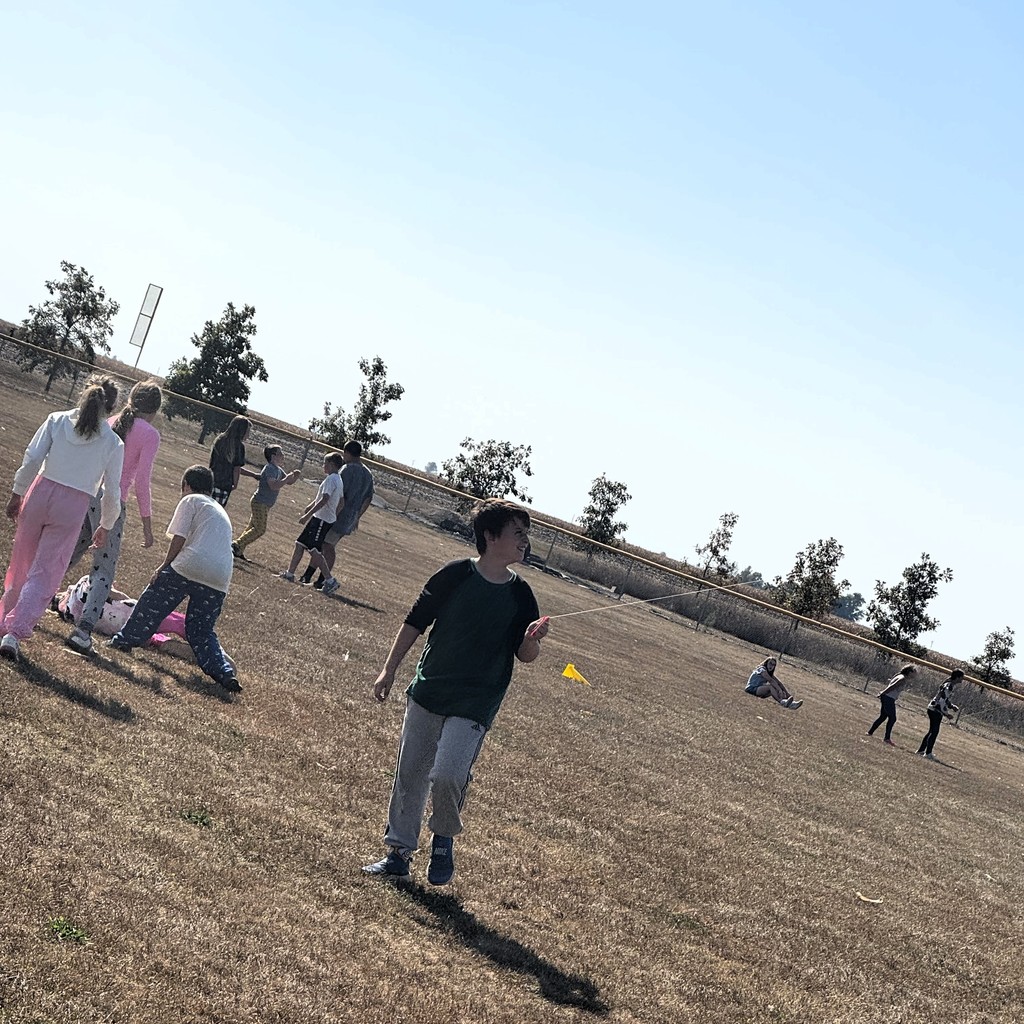 Elementary students fllying kites in PE