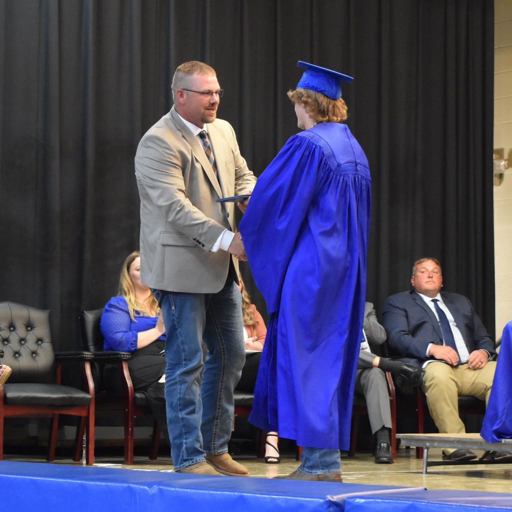 Photos of board members at class of 2025 graduation