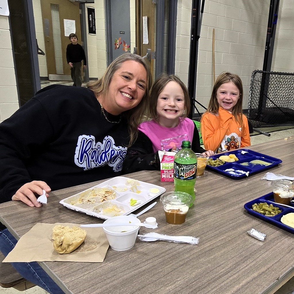 Elementary students in the cafeteria enjoying their Friendsgiving turkey lunch