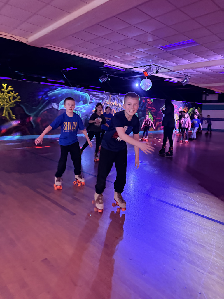 Elementary students roller skating
