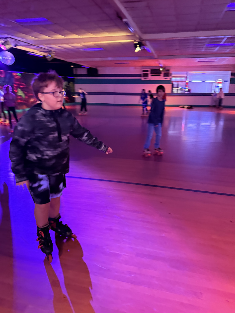 Elementary students roller skating