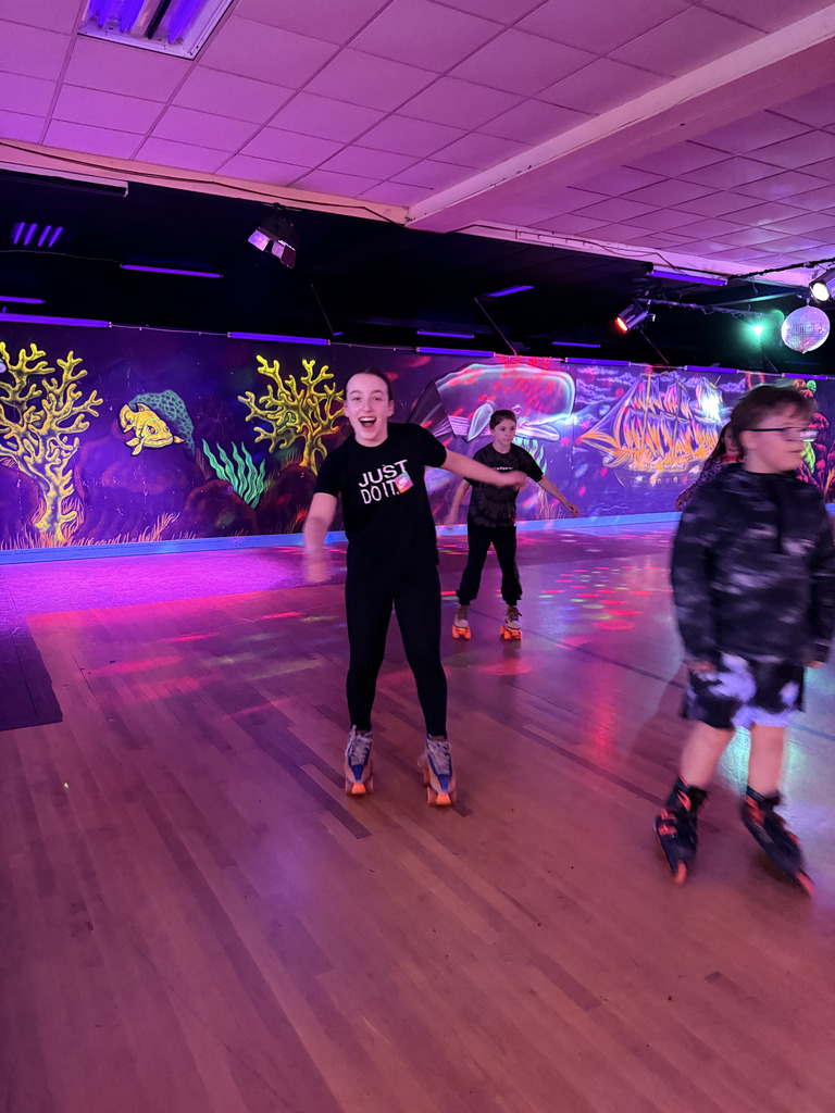 Elementary students roller skating