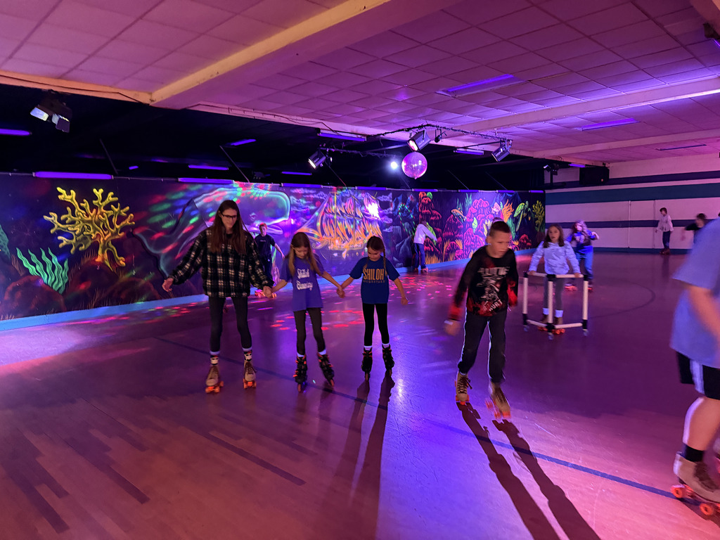 Elementary students roller skating