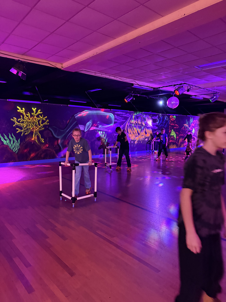 Elementary students roller skating