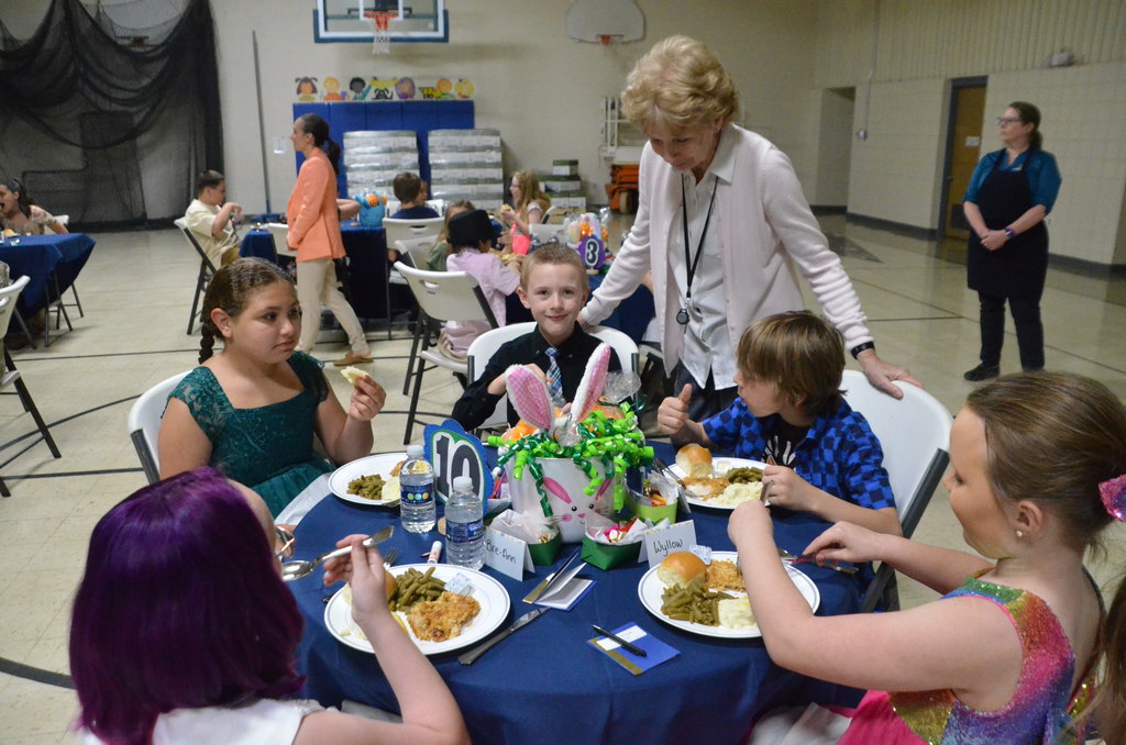 Images of students eating a formal dinner at the 2025 Dine and Dance