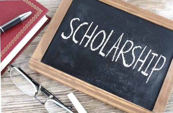 Graphic of "scholarship" written on a small chalkboard