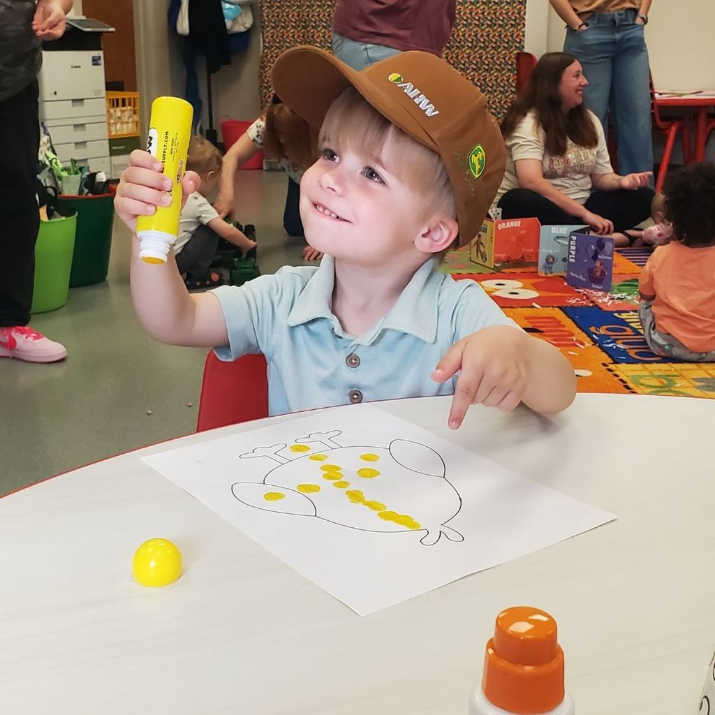 Families and children at PIP group connection in April 2026 observing and interacting with eggs and baby chicks