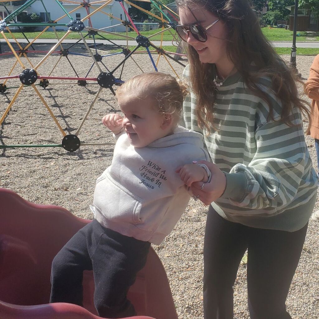 Photos of toddlers and familes on a playground for the May Partnership-in-Parenting group connection
